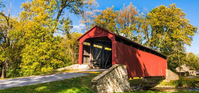 covered red wood bridge